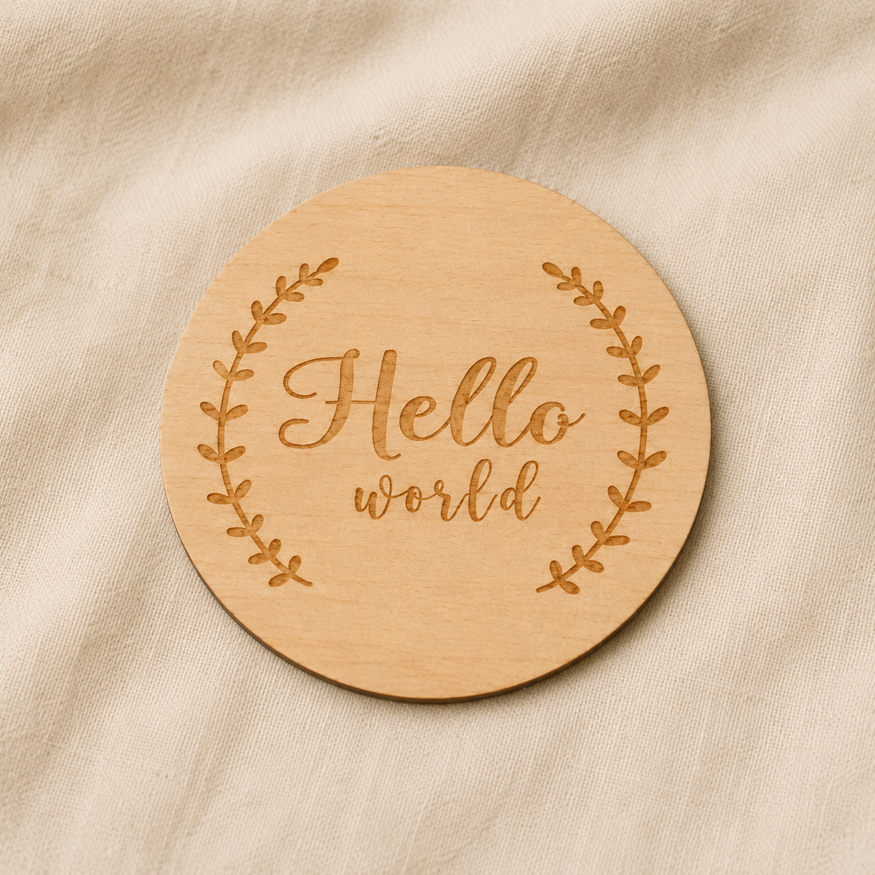 Round wooden Hello World baby announcement disc