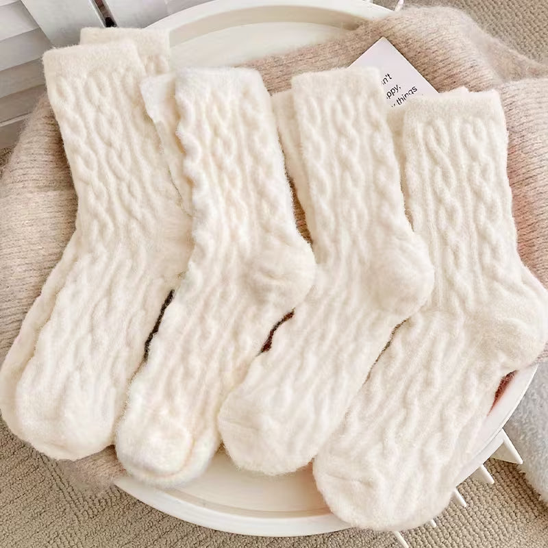Soft cream plush socks arranged neatly, ideal for cozy gift boxes and hampers