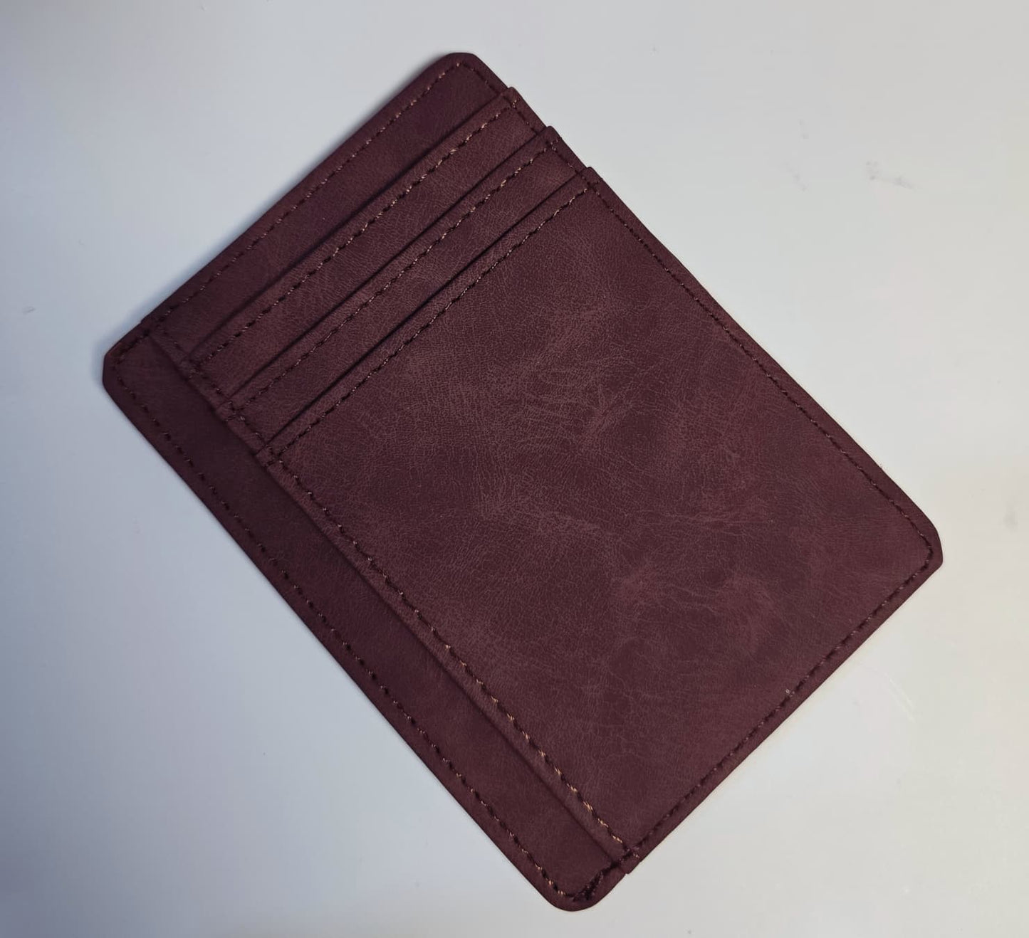 Heritage Man luxury gift box containing a brown leather-style toiletry bag, executive notebook with pen, coffee glass with wooden handle, and FEIDING brown scarf.