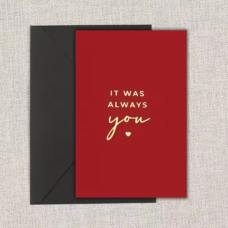 Romantic greeting card with red background and gold text reading “It was always you”