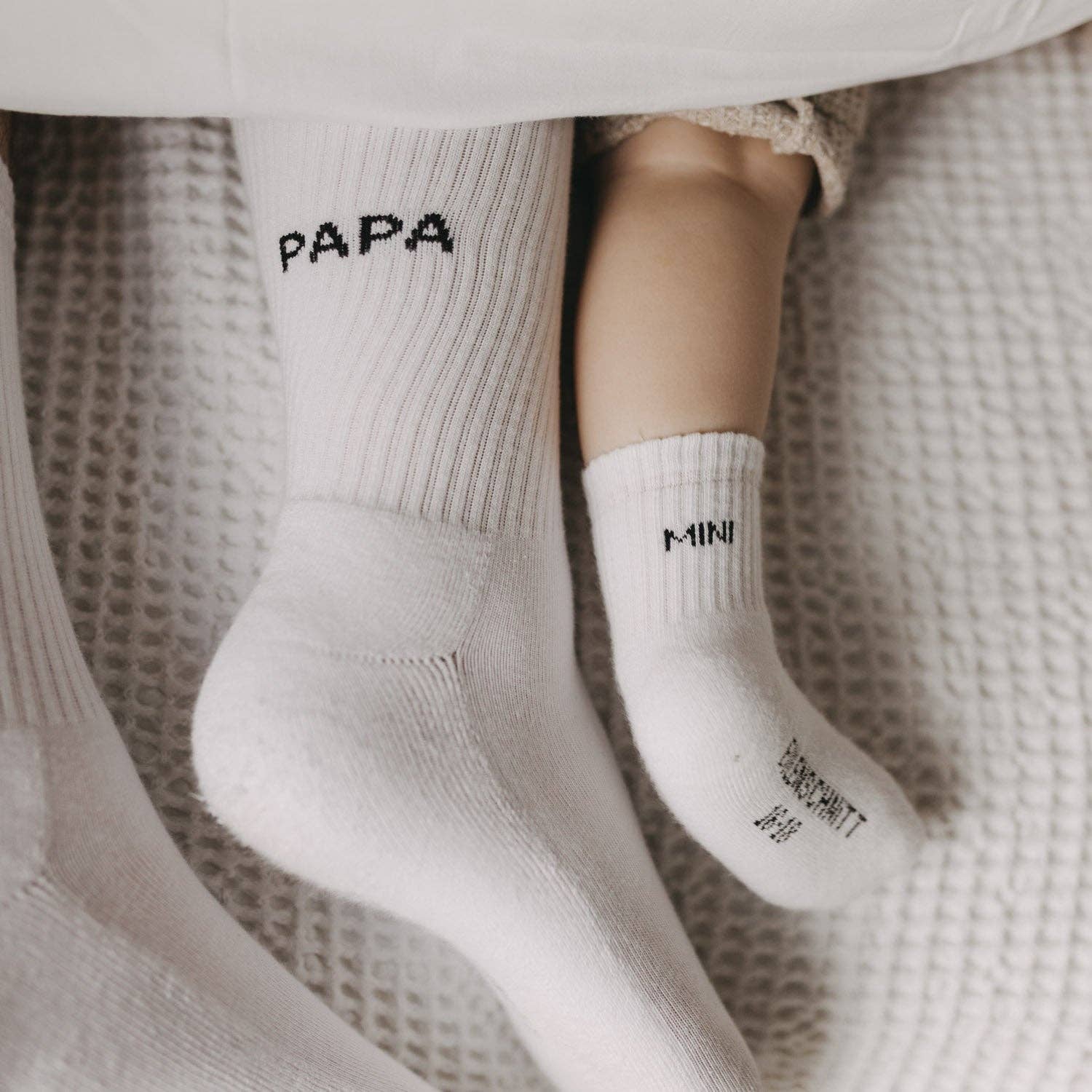 Soft Papa socks with minimalist Papa lettering on the cuff, designed as a comfortable everyday gift for dads.