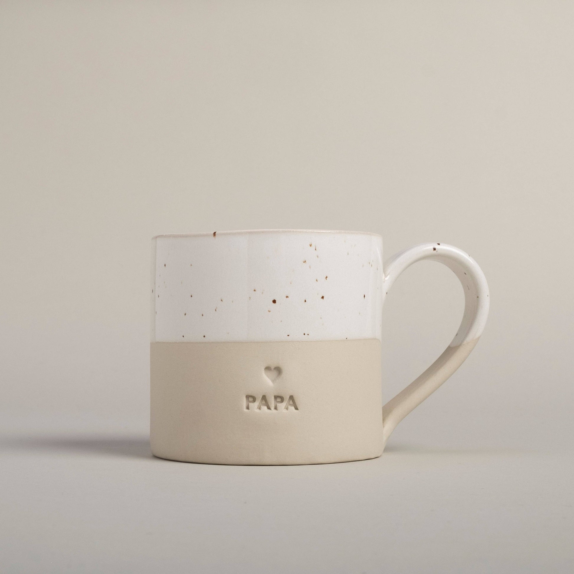 Handmade Papa stoneware mug from Portugal with embossed Papa lettering and natural ceramic glaze.