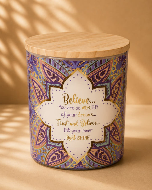 Decorative candle with motivational quote on a beige background