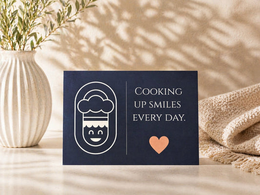 A fun and heartwarming greeting card for anyone who deserves a smile. With its cute chef-inspired illustration and “Cooking Up Smiles Every Day” message, this card adds a playful touch to gifts for food lovers, home cooks, chefs, or anyone who brings joy to your life.

A lovely choice for thank-you gifts, birthday gifts, kitchen-themed presents, or thoughtful everyday surprises.