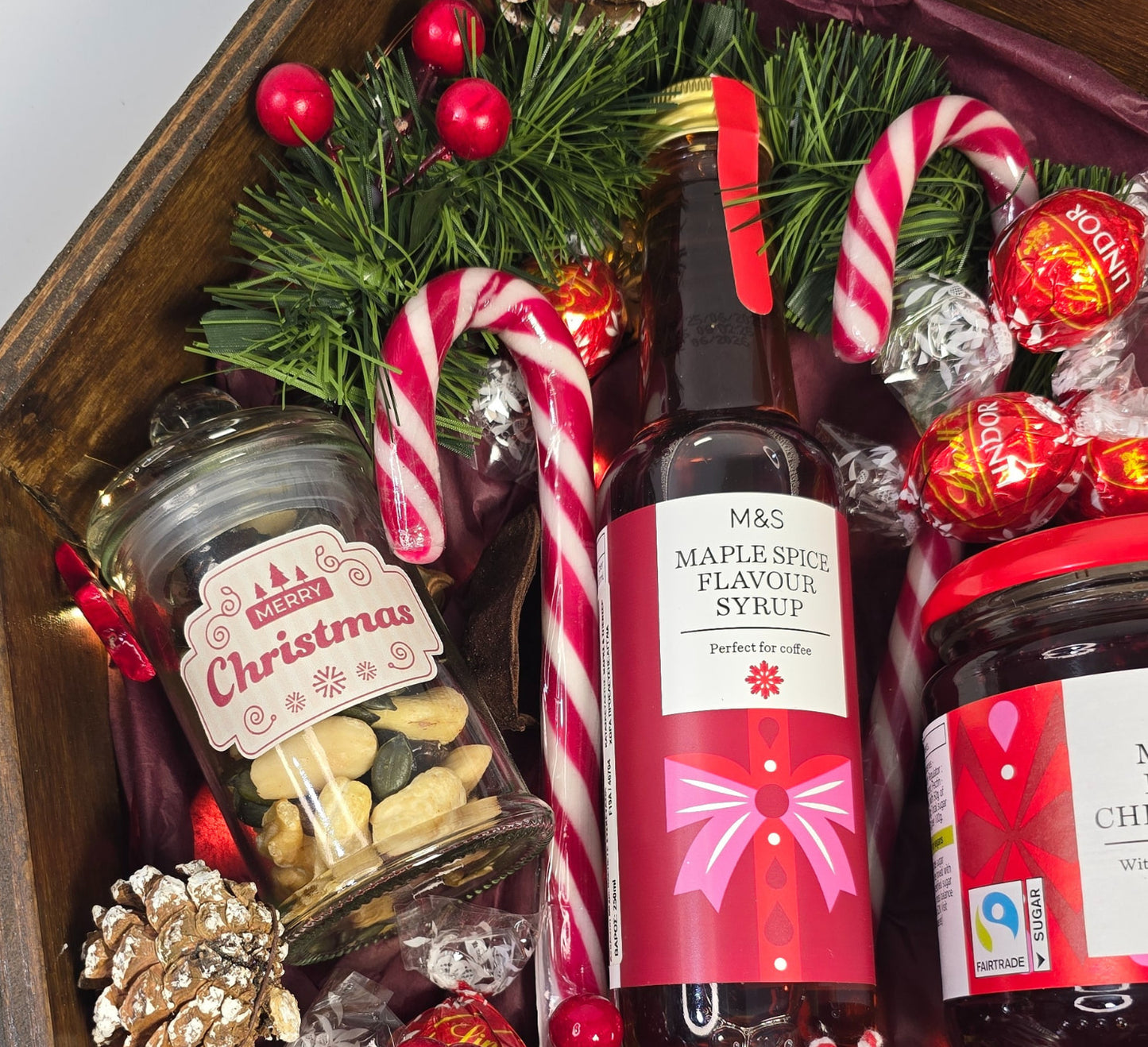 Christmas wooden house gift box with M&S maple spice syrup, cherry jam, candy canes and festive treats – handmade holiday gift from Cyprus