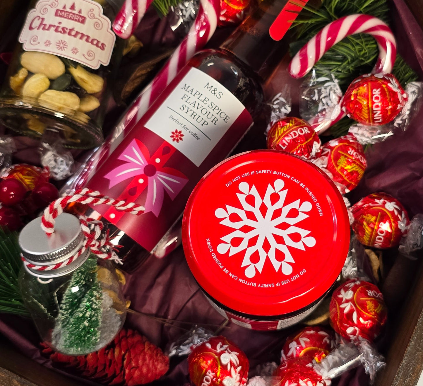 Christmas wooden house gift box with M&S maple spice syrup, cherry jam, candy canes and festive treats – handmade holiday gift from Cyprus