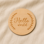 Round wooden Hello World baby announcement disc 