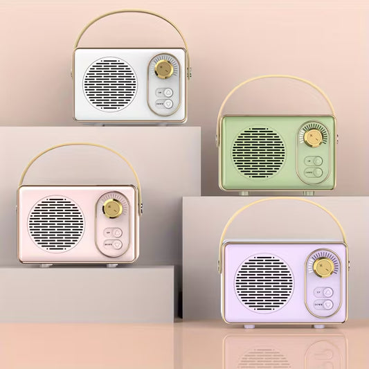 Retro-style portable Bluetooth speaker with gold accents and carry handle placed beside piano keys.