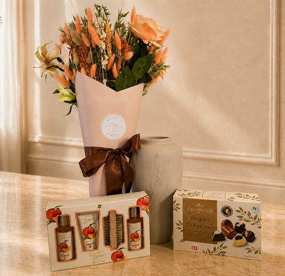 Premium dried flower gift collection featuring a peach-toned dried bouquet, luxury chocolates, and optional self-care essentials, beautifully presented for special occasions.