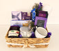 Purple premium corporate gift hamper with tea, coffee, chocolate, shortbread, jam, candle and mug in a woven basket