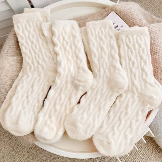 Soft cream plush socks arranged neatly, ideal for cozy gift boxes and hampers