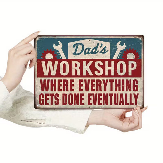 Vintage metal tin sign reading “Dad’s Workshop Where Everything Gets Done Eventually” for garage and man cave wall décor