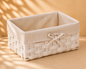 White woven gift basket with fabric lining and ribbon detail, elegant gift packaging basket