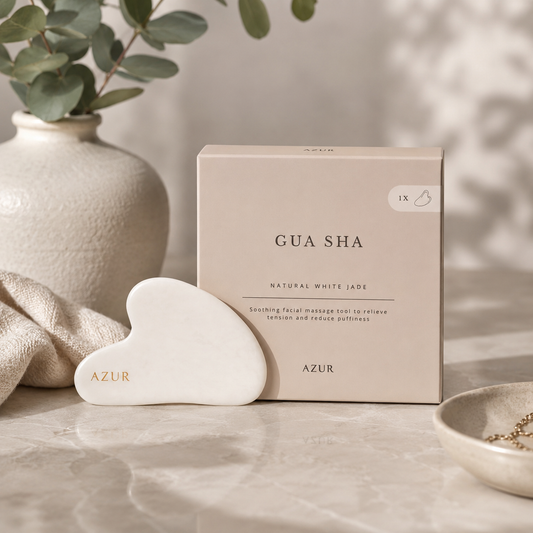 Azur Natural White Jade Gua Sha facial massage tool with elegant packaging displayed on a neutral spa-inspired background for skincare and self-care.