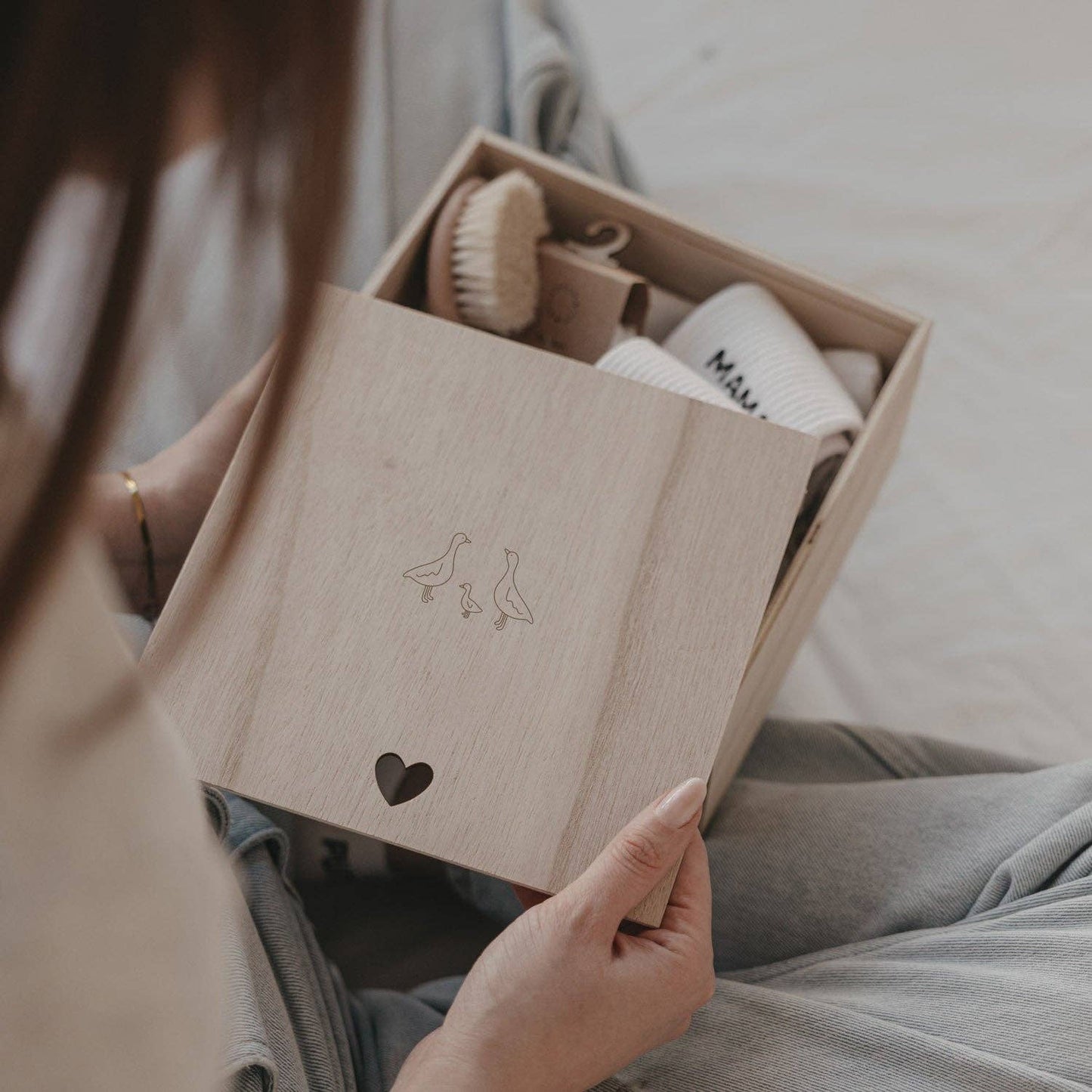 Wooden Geese baby memory box with delicate goose motif and heart-shaped detail, designed for storing newborn and childhood keepsakes.