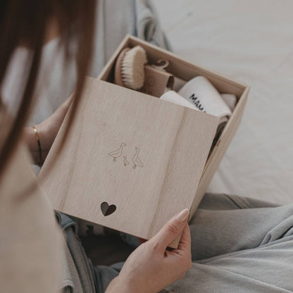 Wooden Geese baby memory box with delicate goose motif and heart-shaped detail, designed for storing newborn and childhood keepsakes.