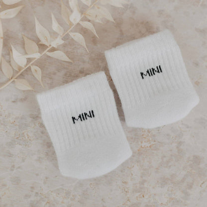 Soft Mini baby socks with minimalist lettering for newborns and sensitive baby skin.