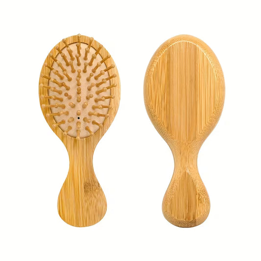 Eco-friendly bamboo wooden hair brush with natural wooden bristles displayed on a neutral background.