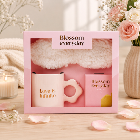 Love Is Infinite Gift Set featuring a pink ceramic mug, black tea, soft eye mask, and elegant gift box designed for relaxation and thoughtful gifting.