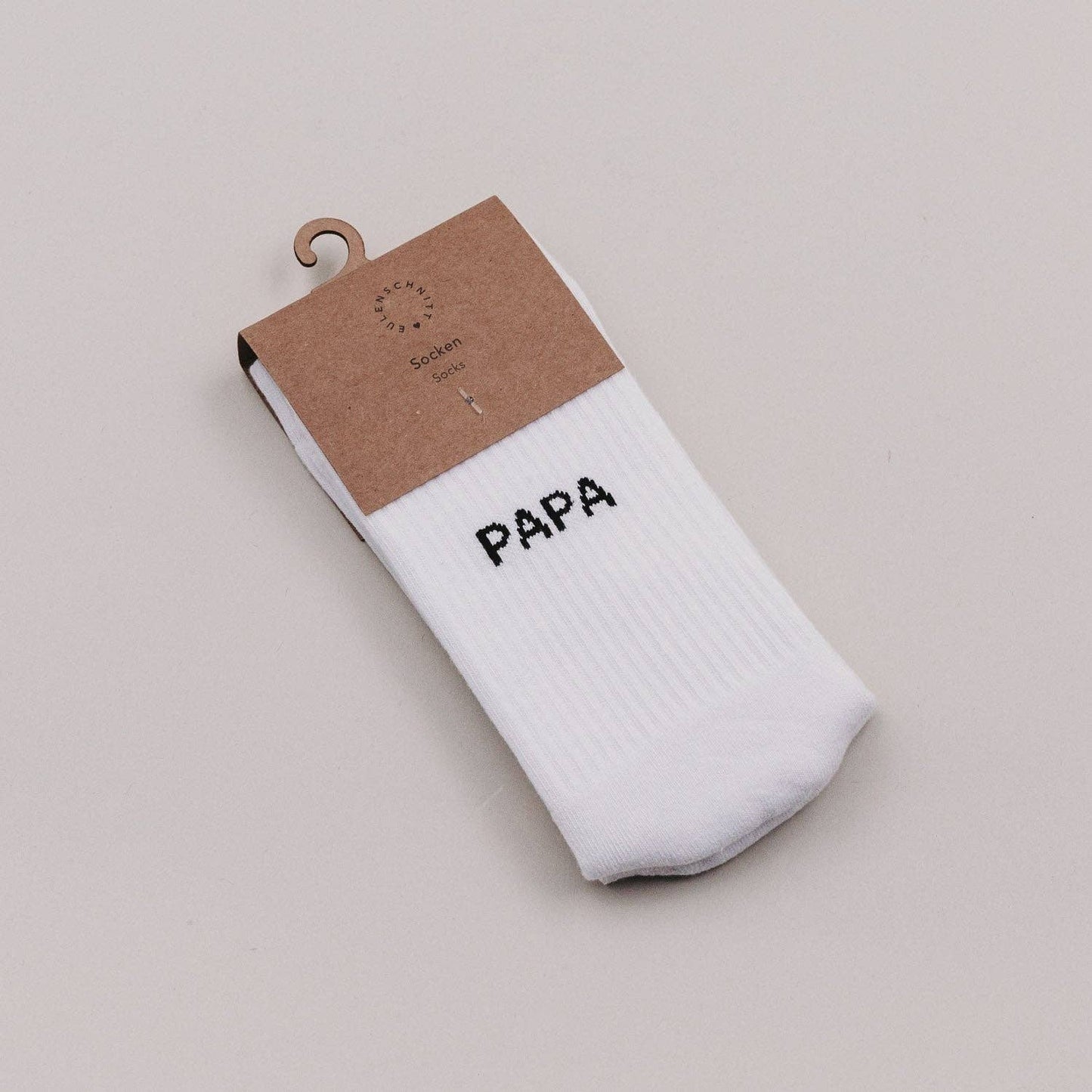 Soft Papa socks with minimalist Papa lettering on the cuff, designed as a comfortable everyday gift for dads.