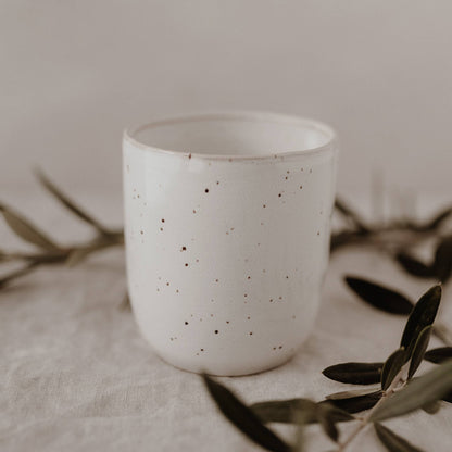 Calma handmade earthenware mug with natural glaze and minimalist design, handcrafted in Portugal with a 320ml capacity.