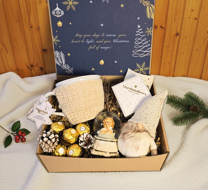 Enchanted Christmas gift box featuring a snow globe, cozy knitted mug, festive gnome, Ferrero Rocher chocolates, and gourmet marshmallows.