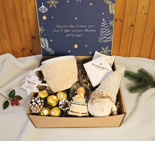 Enchanted Christmas gift box featuring a snow globe, cozy knitted mug, festive gnome, Ferrero Rocher chocolates, and gourmet marshmallows.