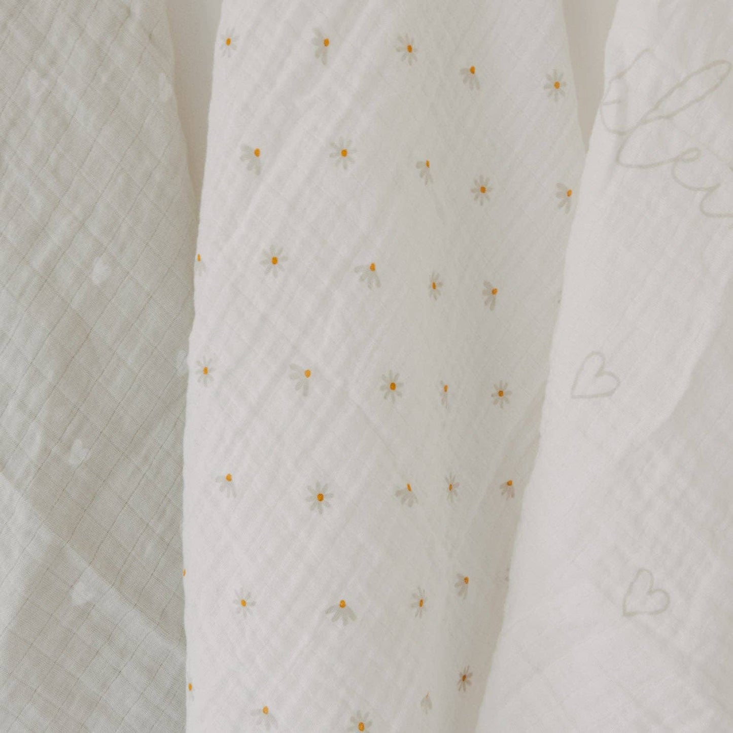 Hello Little Miracle 3-piece cotton muslin cloth set with heart, lettering and daisy designs for babies.