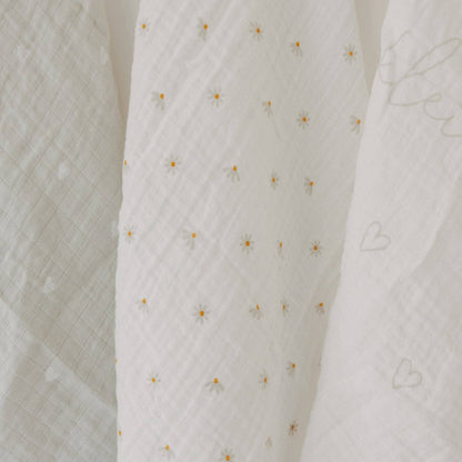 Hello Little Miracle 3-piece cotton muslin cloth set with heart, lettering and daisy designs for babies.