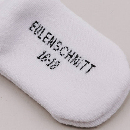 Soft Mini baby socks with minimalist lettering for newborns and sensitive baby skin.