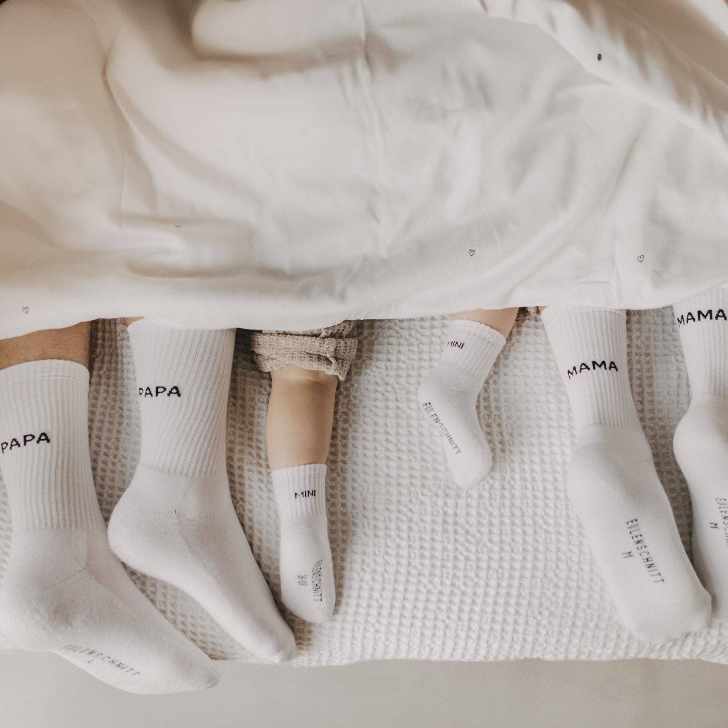 Soft Mini baby socks with minimalist lettering for newborns and sensitive baby skin.