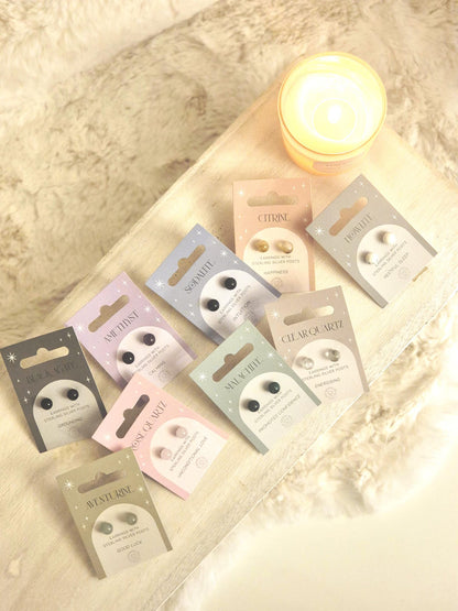 Decorative earrings with a glossy finish displayed on product packaging, designed for a stylish and elegant look.