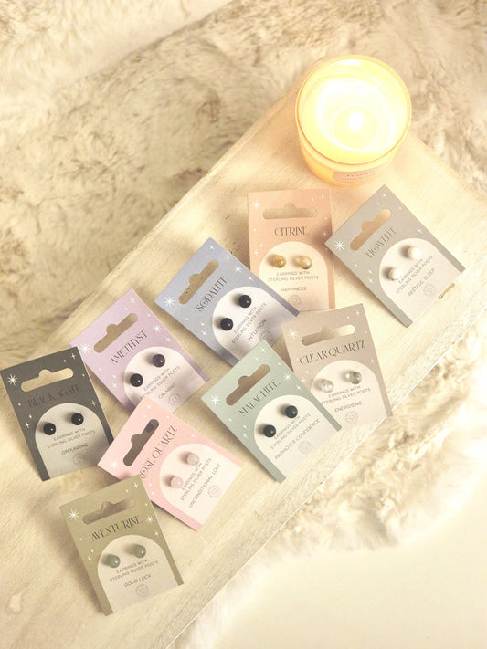 Decorative earrings with a glossy finish displayed on product packaging, designed for a stylish and elegant look.