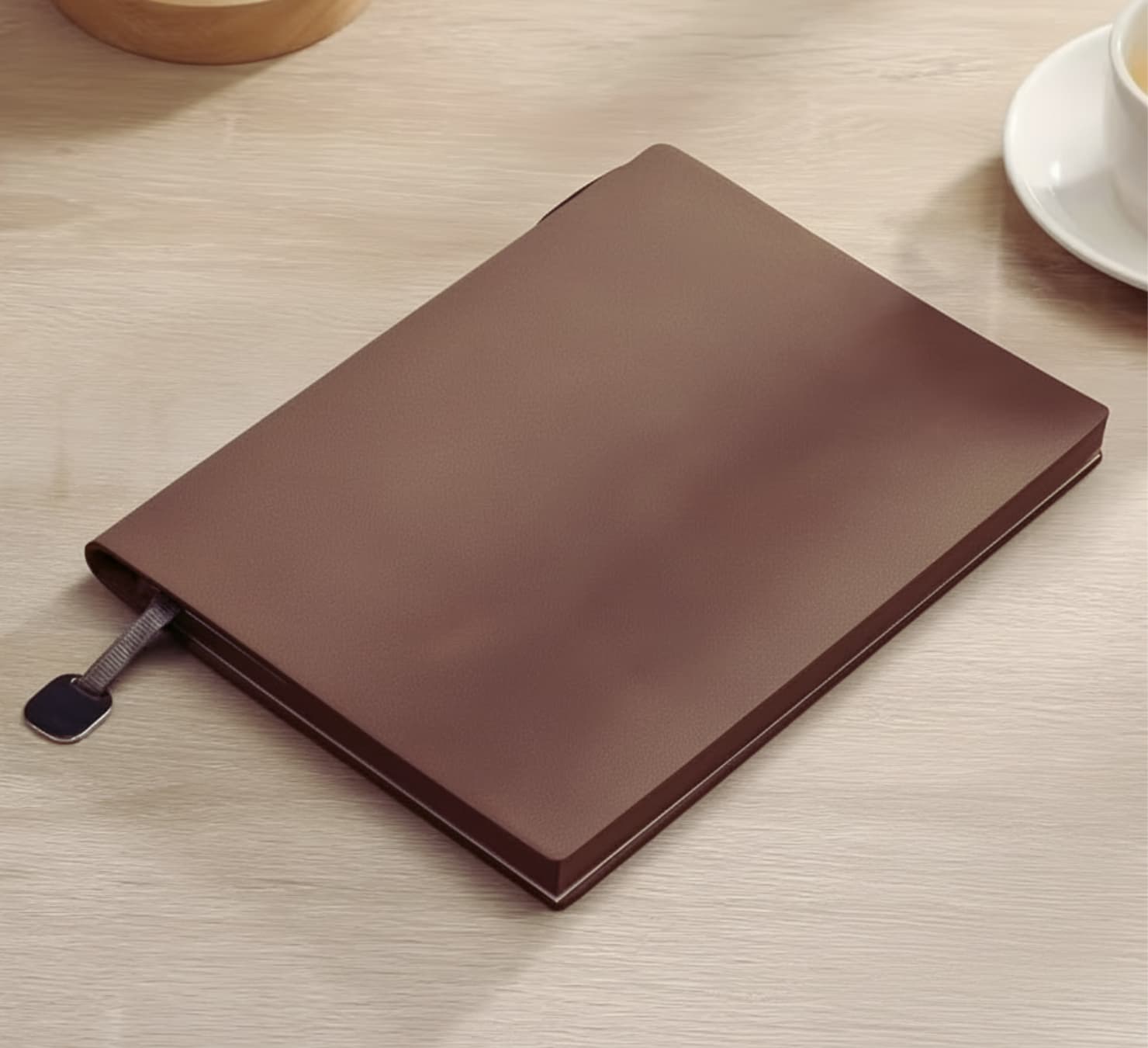 Heritage Man luxury gift box containing a brown leather-style toiletry bag, executive notebook with pen, coffee glass with wooden handle, and FEIDING brown scarf.