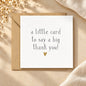 White greeting card reading a little card to say a big thank you with a gold heart and kraft envelope.