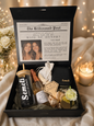 Luxury personalized Maid of Honor proposal gift box featuring a custom tumbler, mini sparkling wine bottle, personalized accessories, rose, and heartfelt proposal card inside a black keepsake box with the name .