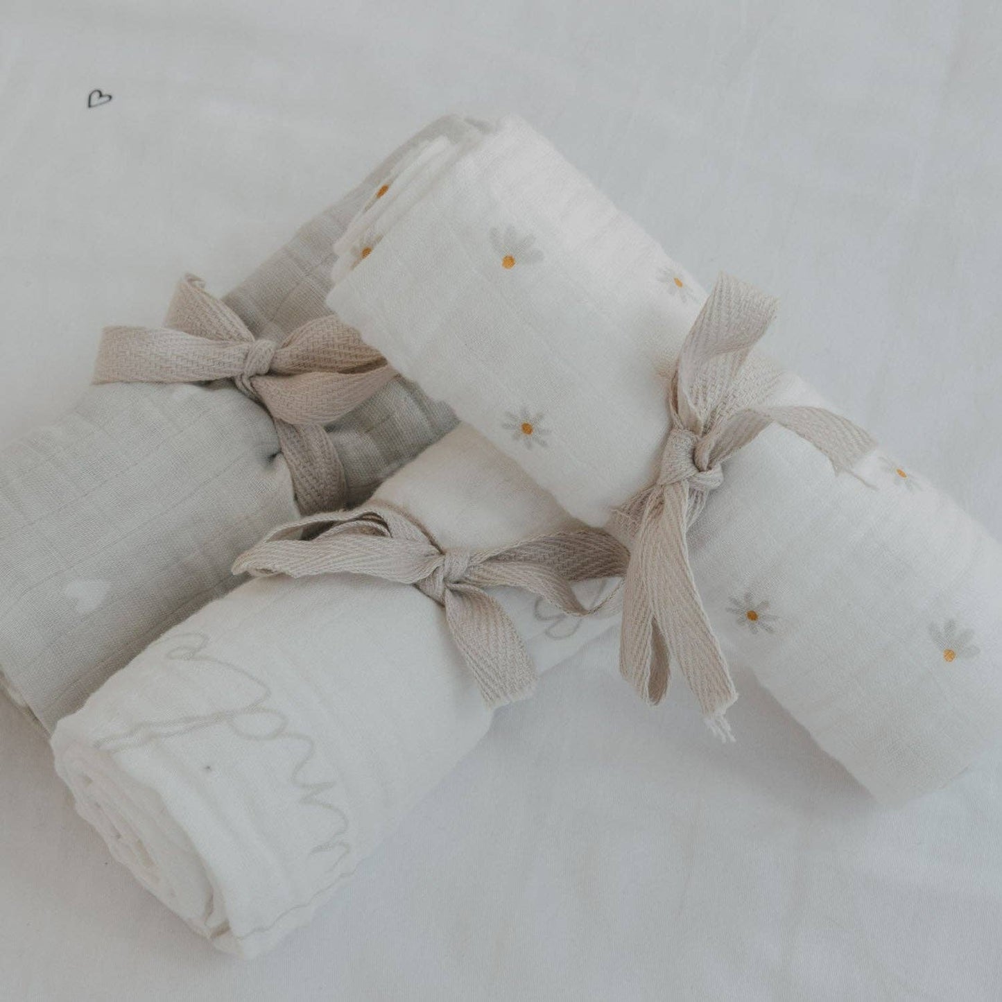 Hello Little Miracle 3-piece cotton muslin cloth set with heart, lettering and daisy designs for babies.