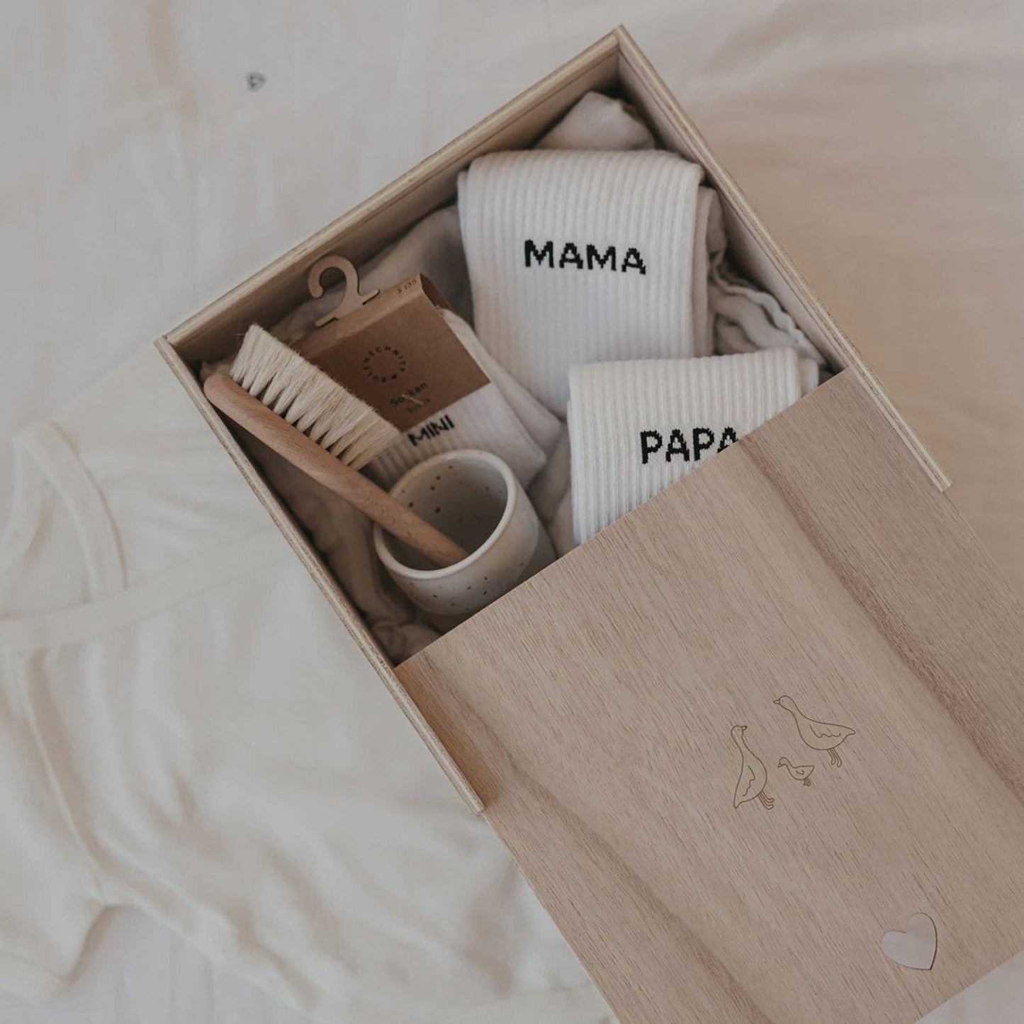Wooden Geese baby memory box with delicate goose motif and heart-shaped detail, designed for storing newborn and childhood keepsakes.