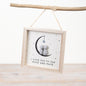 Wooden hanging frame with crescent moon, small couple figures, star detail, and “I love you to the moon and back” message in a soft neutral design.